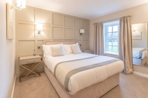 neutral bedroom with wall panelling